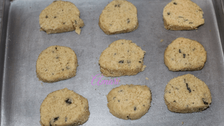 Raw cookies on pan by Amari