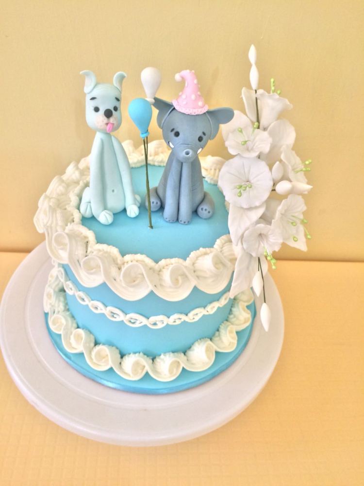 Blue cake with figurine and flowers by Evelyn - PurpleSugarcraft